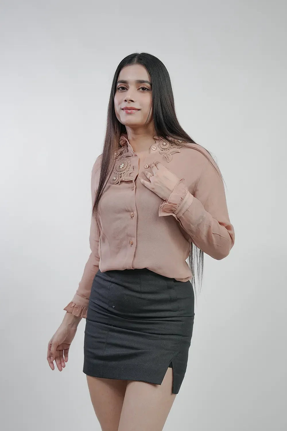 Woman in pink embroidered blouse and black mini skirt, fashion style for Streiq