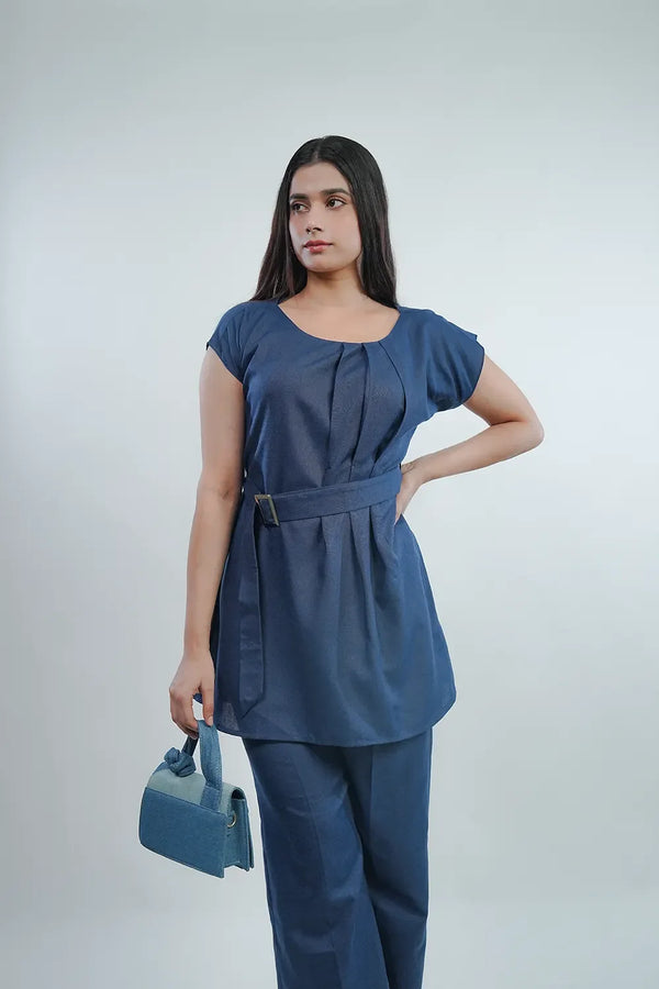 Woman in stylish navy blue belted tunic and pants holding a matching handbag, Streiq fashion